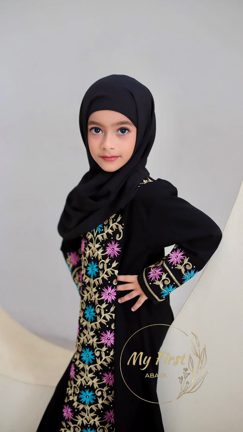 The Safiyya abaya. Modest dress for young girls ages 4 to 12 years of age. Plain black headscarf is included.