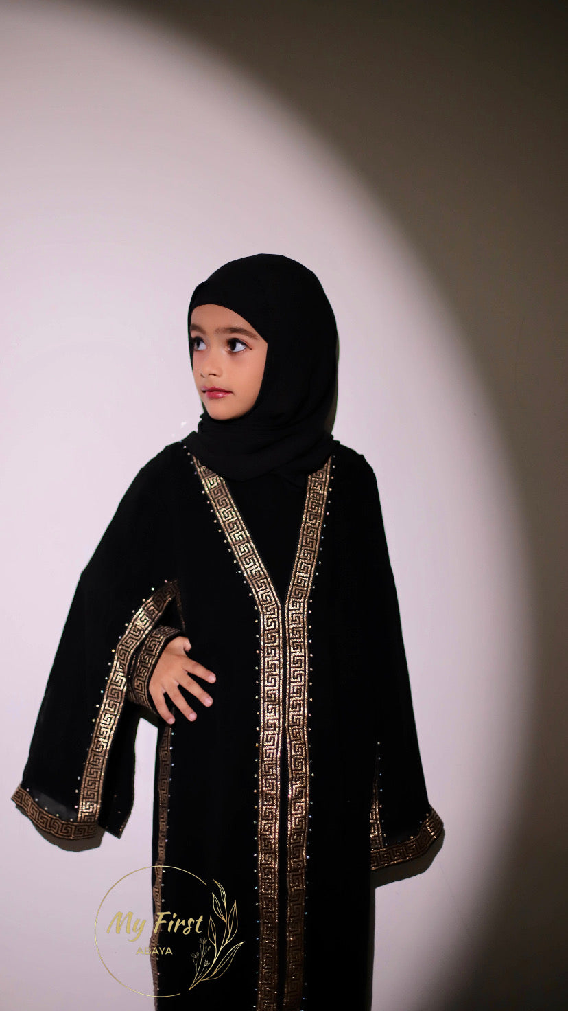 The Aasiyah abaya. Modest dress for young girls. Ages 4 to 12 years of age. Plain black headscarf is included.