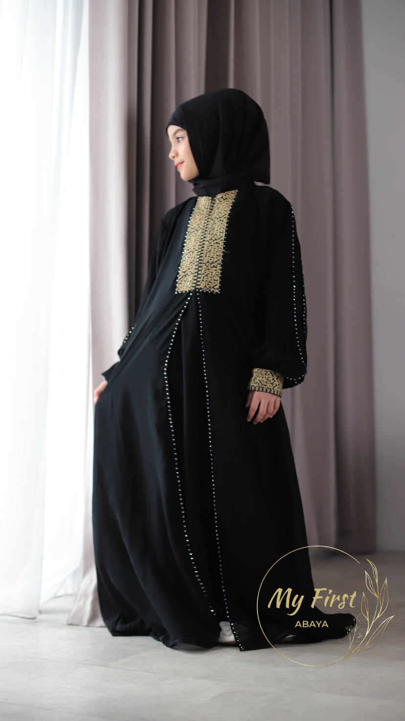 The Khadijah abaya. Modest dress for young girls ages 4 to 12 years of age. Plain black headscarf is included.
