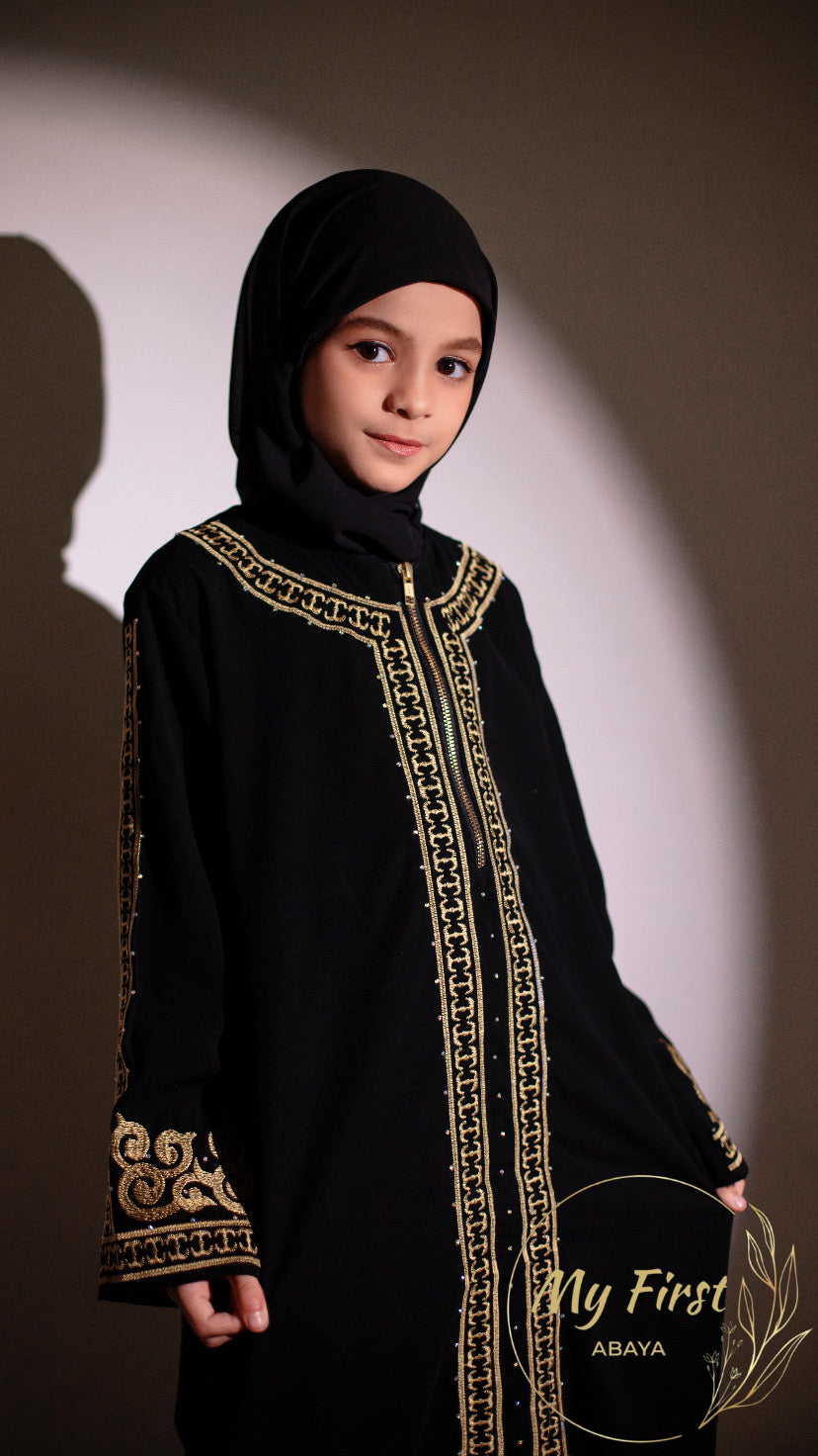 The Habiba abaya. Modest dress for young girls ages 4 to 12 years of age. Plain black headscarf is included.