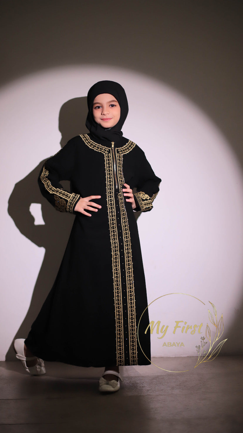 The Habiba abaya. Modest dress for young girls ages 4 to 12 years of age. Plain black headscarf is included.