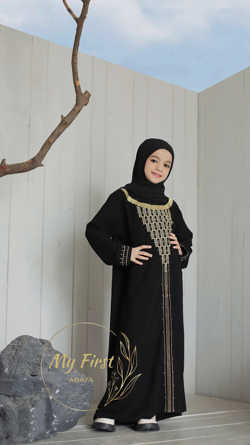 The Fatimah abaya. Modest dress for young girls ages 4 to 12 years of age. Plain black headscarf is included.