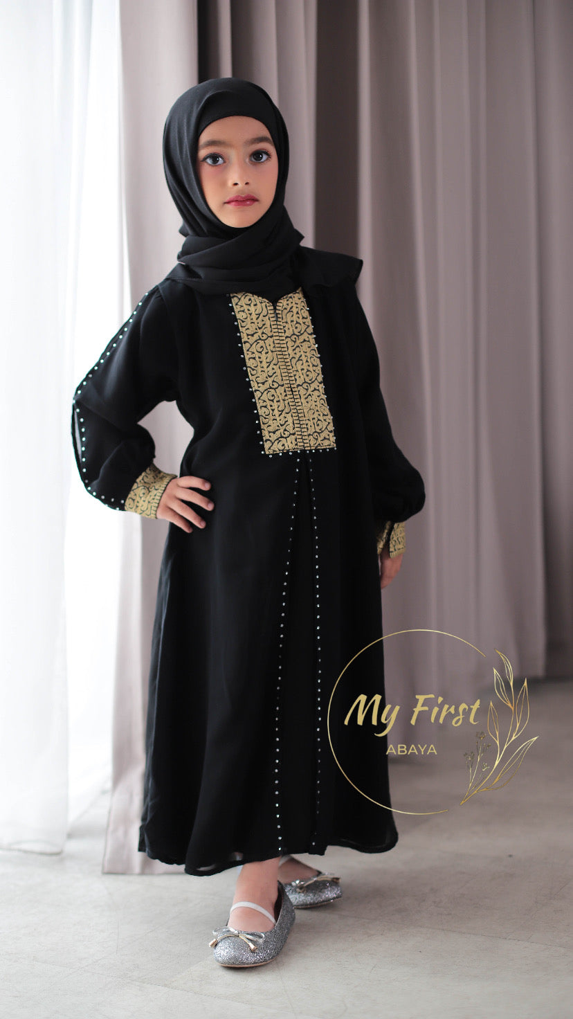 The Khadijah abaya. Modest dress for young girls ages 4 to 12 years of age. Plain black headscarf is included.