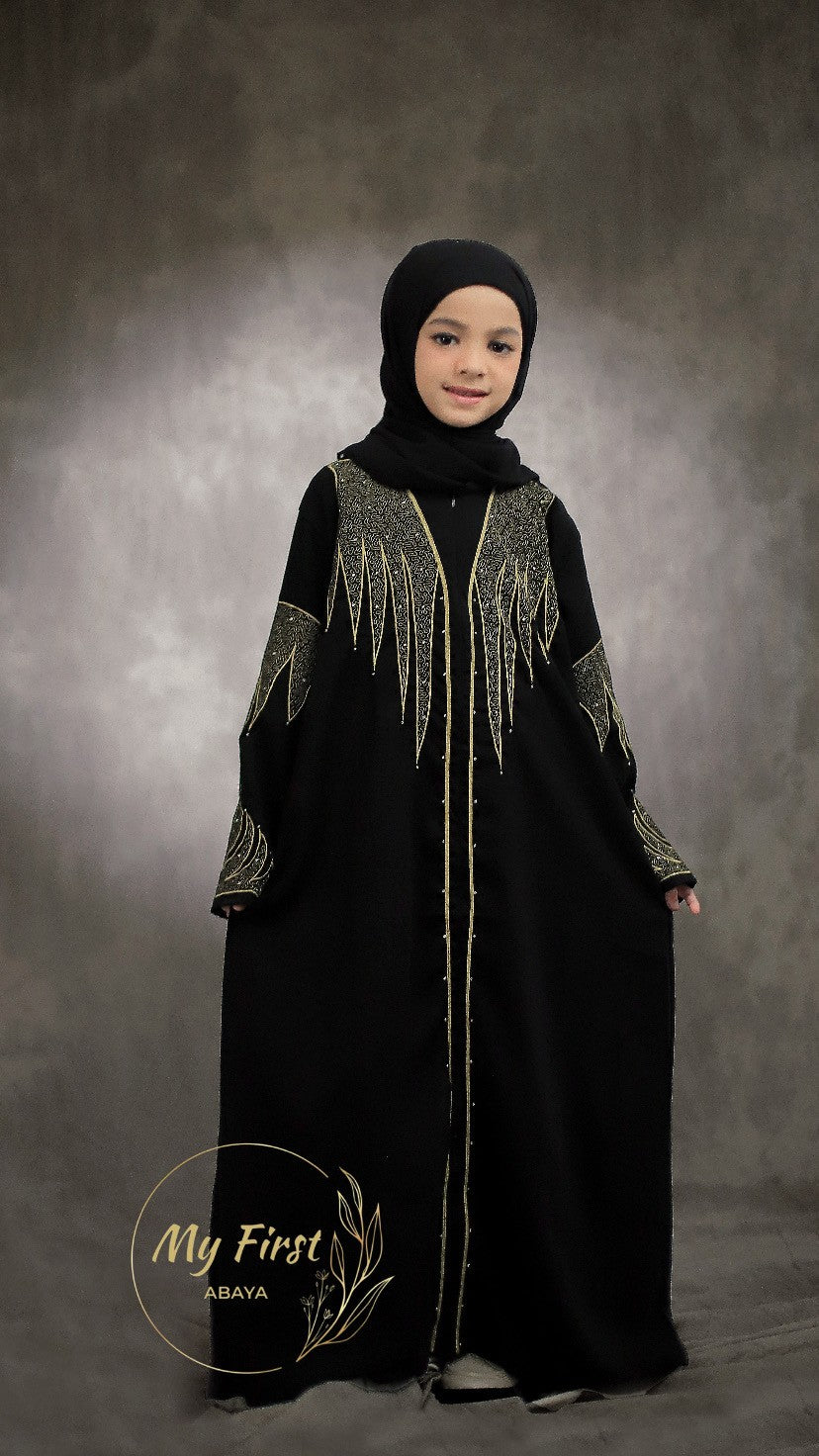 The Aisyah abaya. Modest black abaya dress for young girls ages 4 to 12 years of age. Plain black headscarf is included.