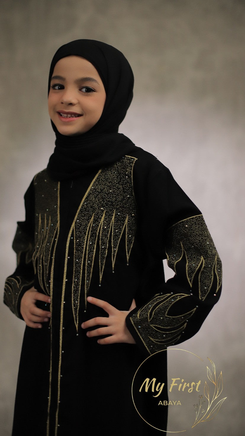 The Aisyah abaya. Modest black abaya dress for young girls ages 4 to 12 years of age. Plain black headscarf is included.