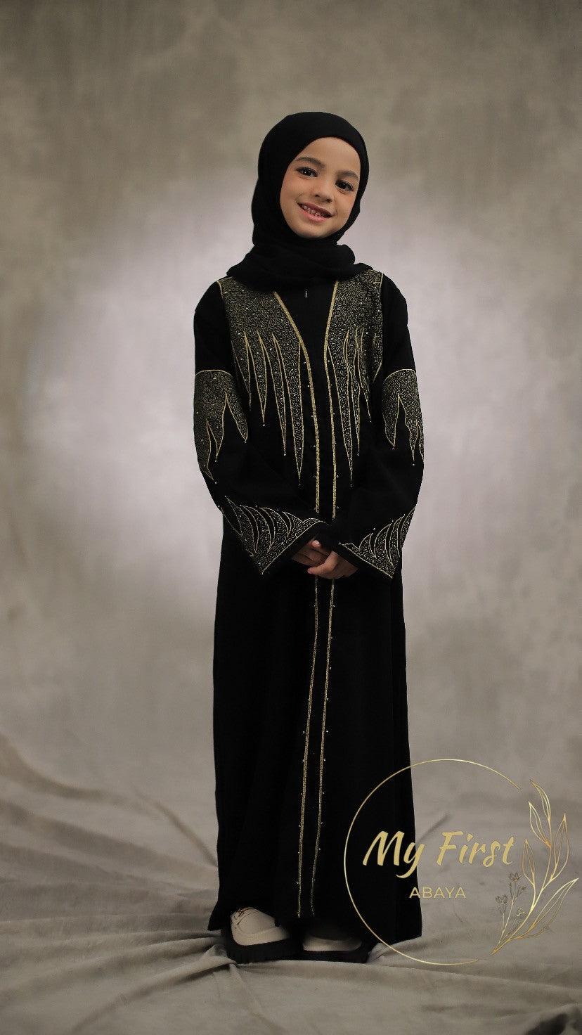 The Aisyah abaya. Modest black abaya dress for young girls ages 4 to 12 years of age. Plain black headscarf is included.