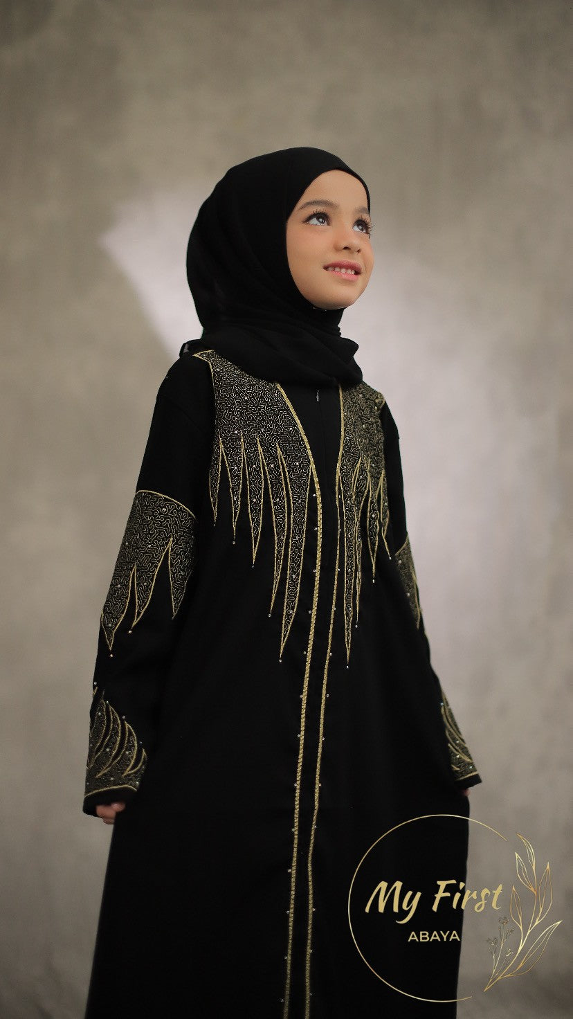 The Aisyah abaya. Modest black abaya dress for young girls ages 4 to 12 years of age. Plain black headscarf is included.