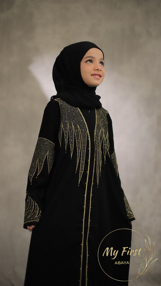 The Aisyah abaya. Modest black abaya dress for young girls ages 4 to 12 years of age. Plain black headscarf is included.
