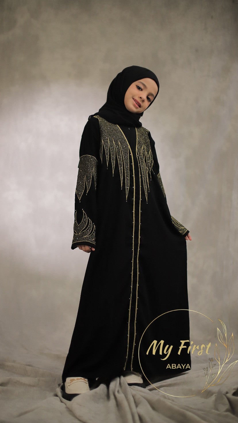 The Aisyah abaya. Modest black abaya dress for young girls ages 4 to 12 years of age. Plain black headscarf is included.