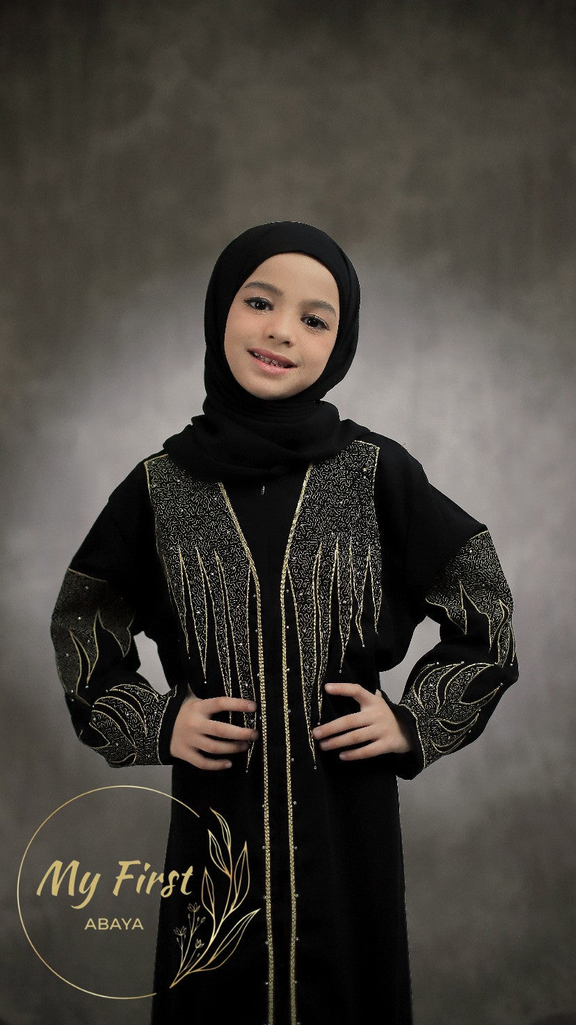 The Aisyah abaya. Modest black abaya dress for young girls ages 4 to 12 years of age. Plain black headscarf is included.
