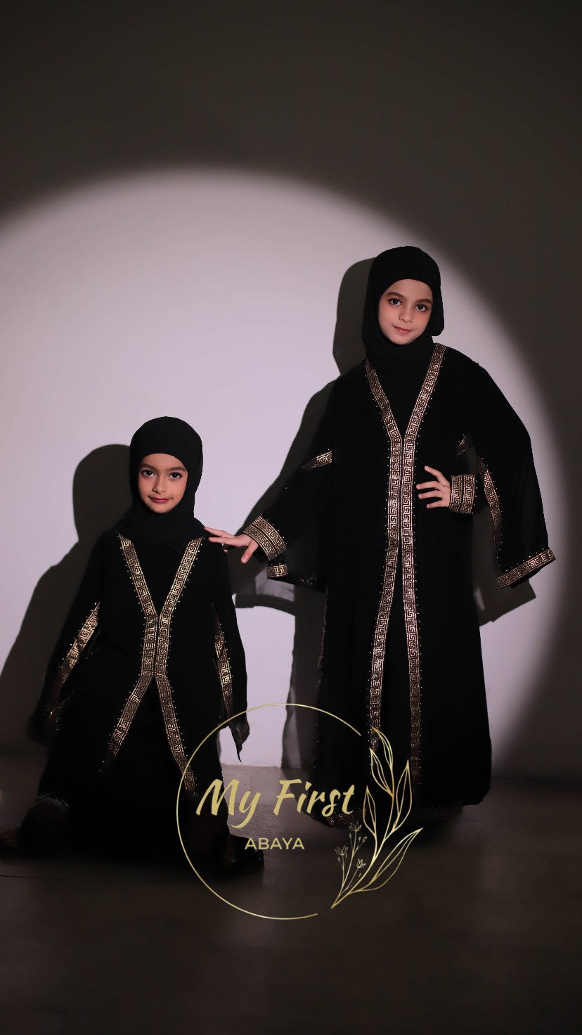 The Aasiyah abaya. Modest dress for young girls. Ages 4 to 12 years of age. Plain black headscarf is included.