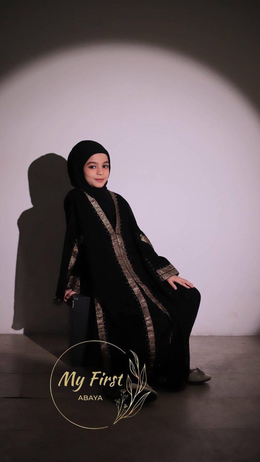 The Aasiyah abaya. Modest dress for young girls. Ages 4 to 12 years of age. Plain black headscarf is included.