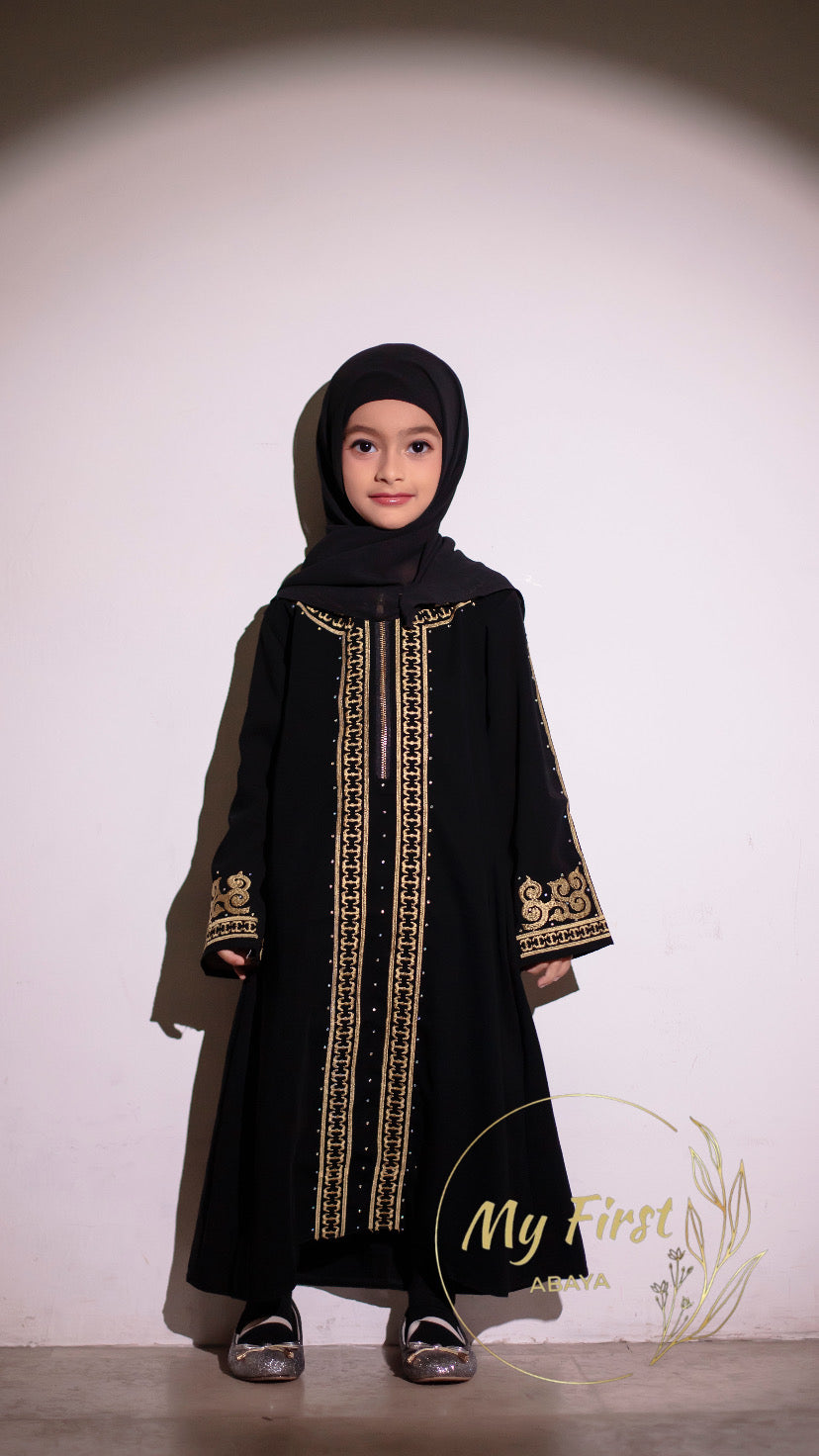 The Habiba abaya. Modest dress for young girls ages 4 to 12 years of age. Plain black headscarf is included.