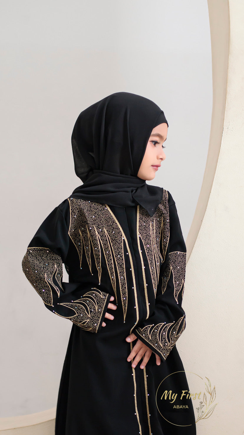 The Aisyah abaya. Modest black abaya dress for young girls ages 4 to 12 years of age. Plain black headscarf is included.