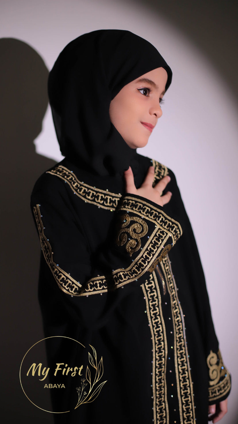 The Habiba abaya. Modest dress for young girls ages 4 to 12 years of age. Plain black headscarf is included.