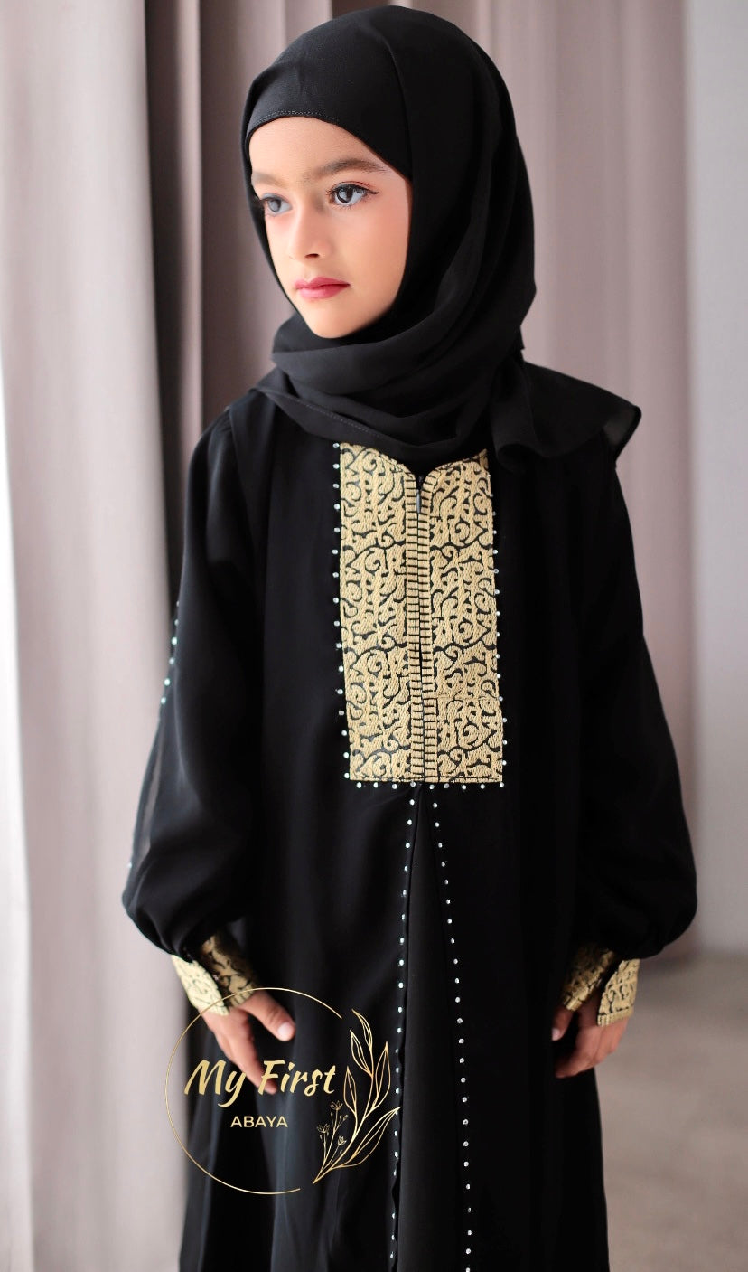 The Khadijah abaya. Modest dress for young girls ages 4 to 12 years of age. Plain black headscarf is included.