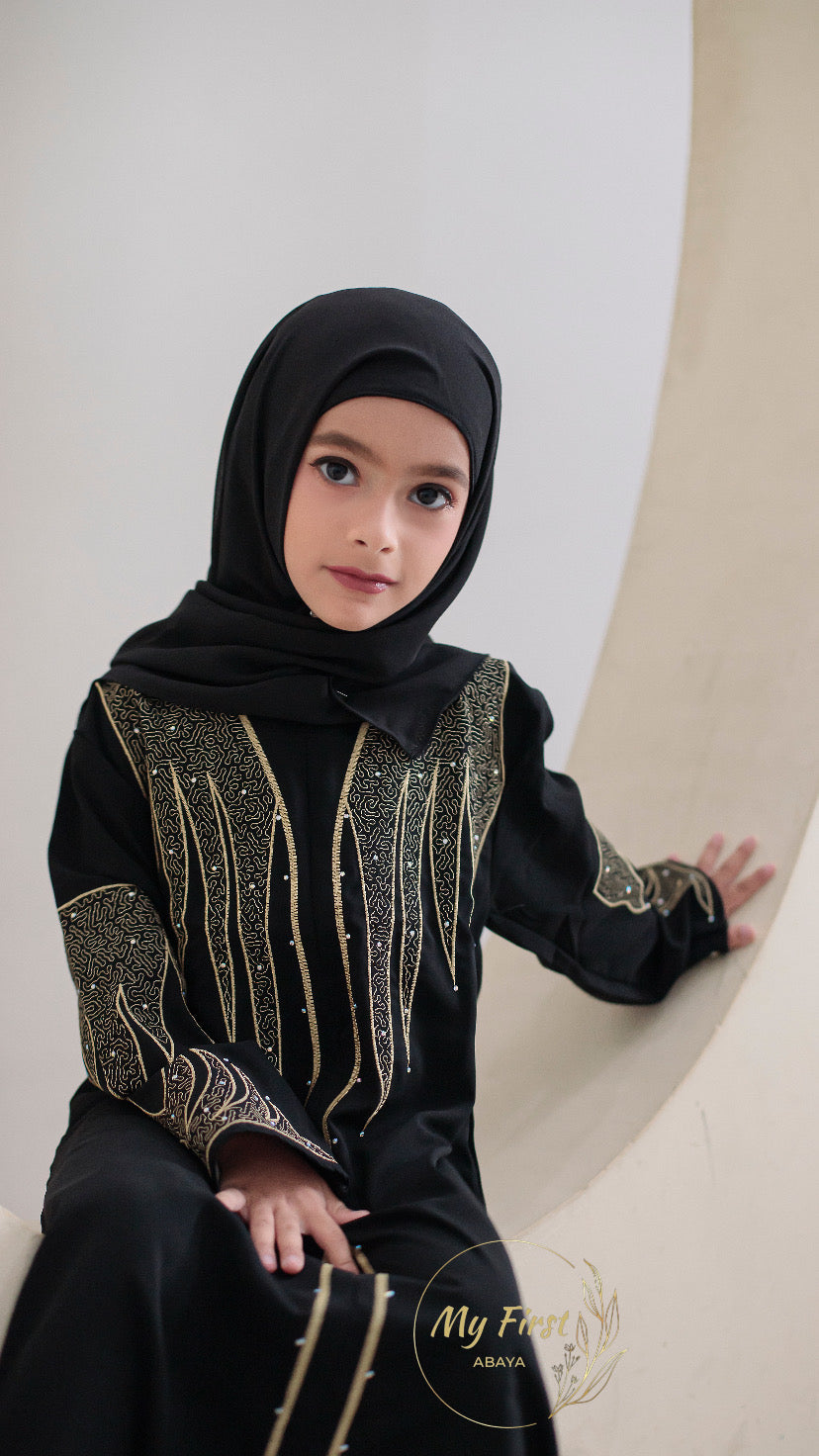The Aisyah abaya. Modest black abaya dress for young girls ages 4 to 12 years of age. Plain black headscarf is included.