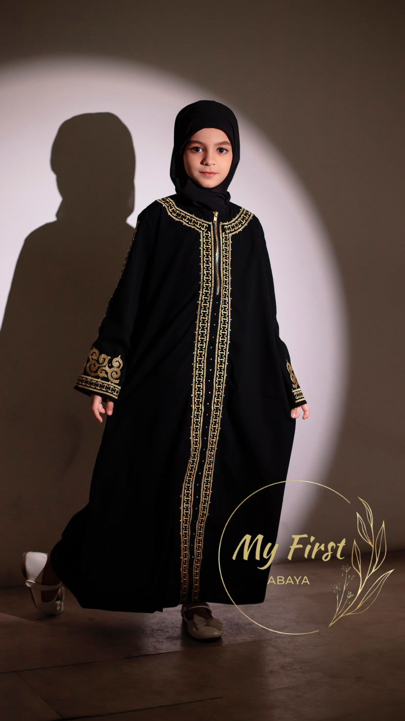 The Habiba abaya. Modest dress for young girls ages 4 to 12 years of age. Plain black headscarf is included.