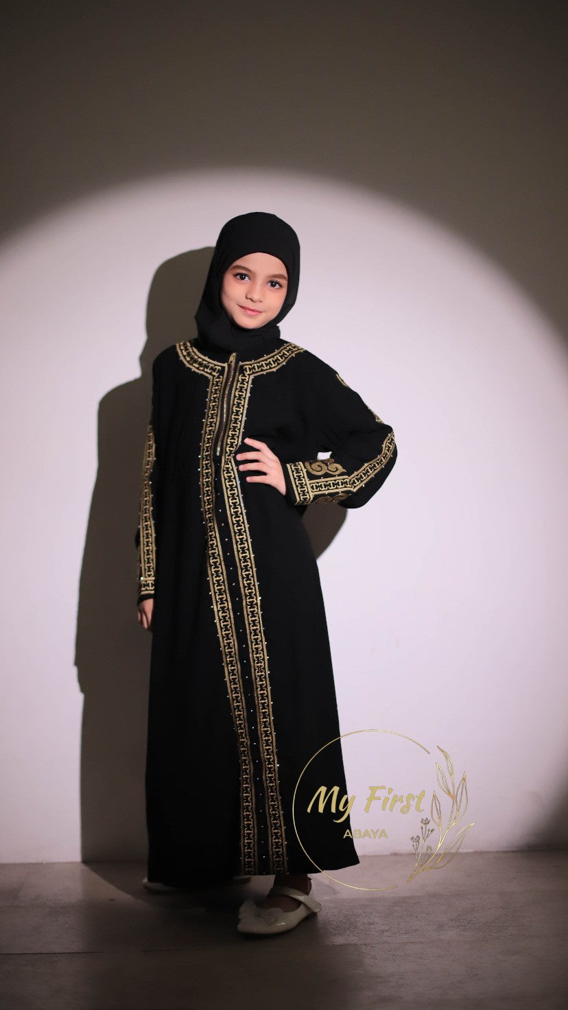 The Habiba abaya. Modest dress for young girls ages 4 to 12 years of age. Plain black headscarf is included.