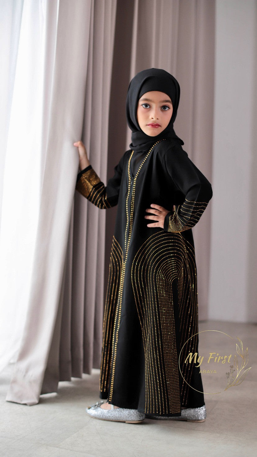 The Hawwa abaya. Modest black girls abaya with Swarovski rhinestones throughout the dress. Sizes available for young girls ages 4 to 12 years old.