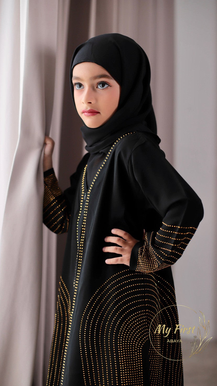The Hawwa abaya. Modest black girls abaya with Swarovski rhinestones throughout the dress. Sizes available for young girls ages 4 to 12 years old.