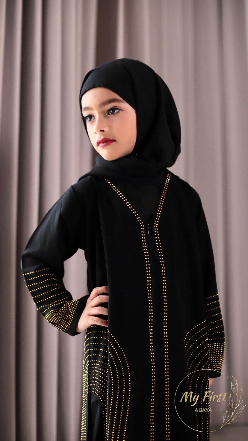 The Hawwa abaya. Modest black girls abaya with Swarovski rhinestones throughout the dress. Sizes available for young girls ages 4 to 12 years old.