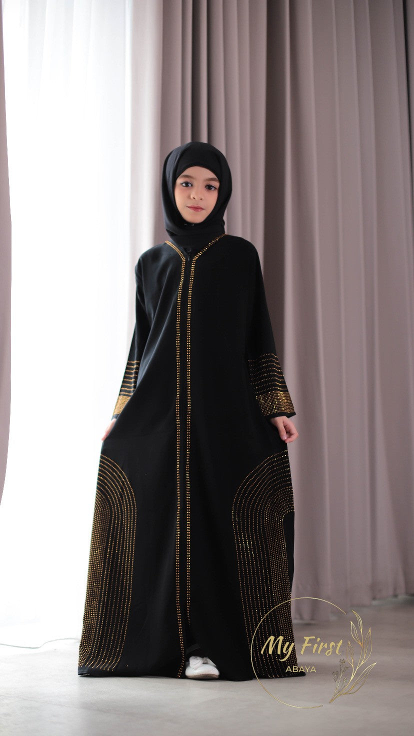 The Hawwa abaya. Modest black girls abaya with Swarovski rhinestones throughout the dress. Sizes available for young girls ages 4 to 12 years old.