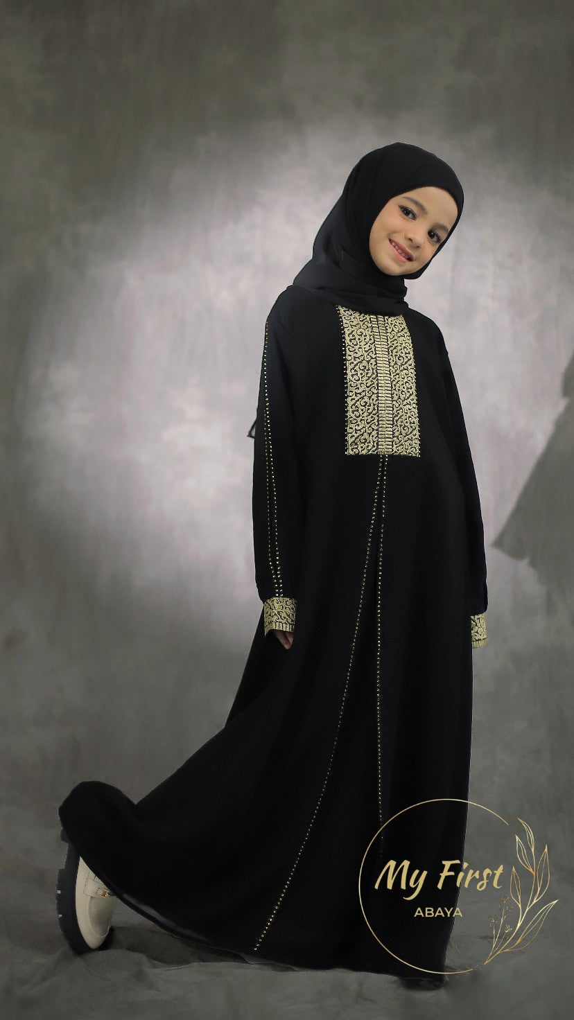 The Khadijah abaya. Modest dress for young girls ages 4 to 12 years of age. Plain black headscarf is included.