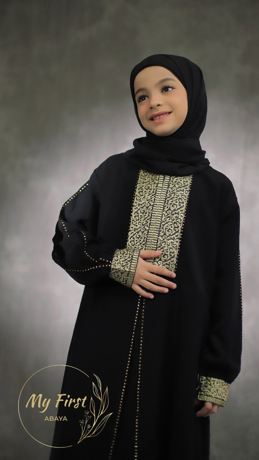 The Khadijah abaya. Modest dress for young girls ages 4 to 12 years of age. Plain black headscarf is included.