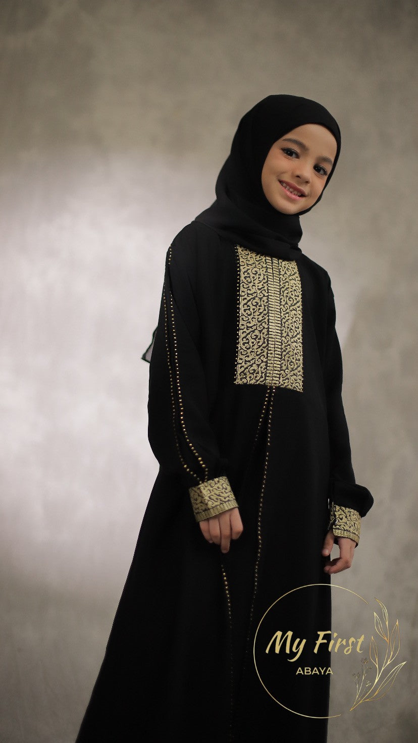 The Khadijah abaya. Modest dress for young girls ages 4 to 12 years of age. Plain black headscarf is included.