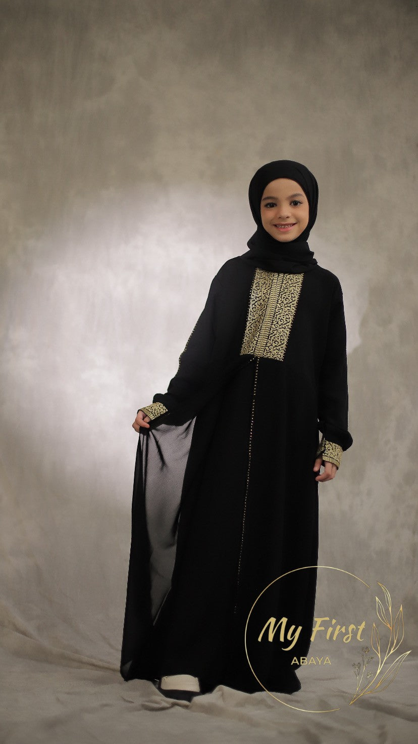 The Khadijah abaya. Modest dress for young girls ages 4 to 12 years of age. Plain black headscarf is included.