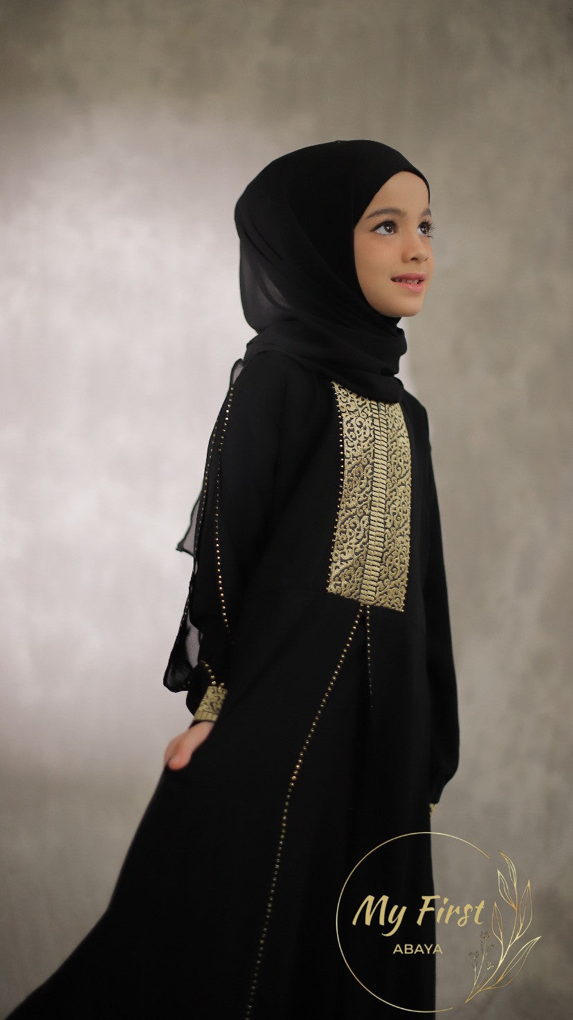The Khadijah abaya. Modest dress for young girls ages 4 to 12 years of age. Plain black headscarf is included.