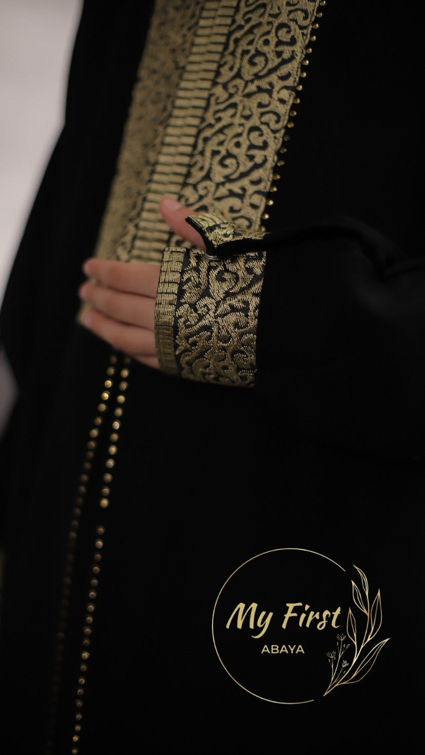 The Khadijah abaya. Modest dress for young girls ages 4 to 12 years of age. Plain black headscarf is included.