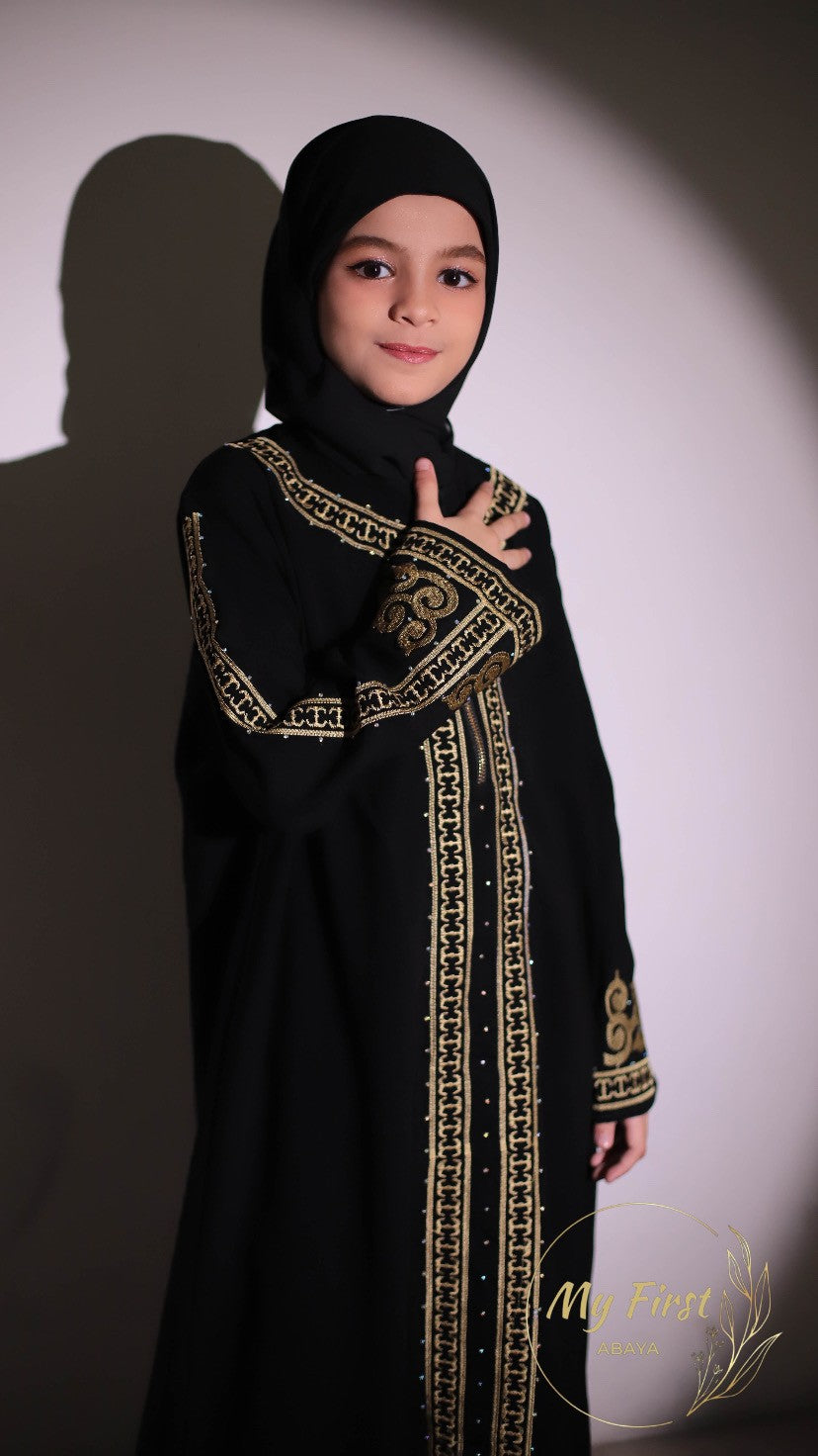 The Habiba abaya. Modest dress for young girls ages 4 to 12 years of age. Plain black headscarf is included.