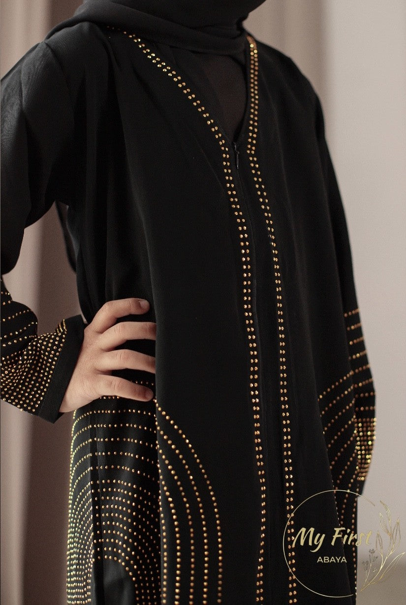 The Hawwa abaya. Modest black girls abaya with Swarovski rhinestones throughout the dress. Sizes available for young girls ages 4 to 12 years old.