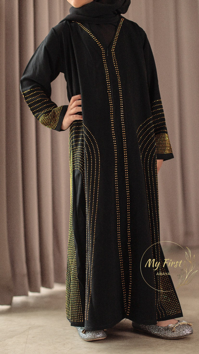 The Hawwa abaya. Modest black girls abaya with Swarovski rhinestones throughout the dress. Sizes available for young girls ages 4 to 12 years old.