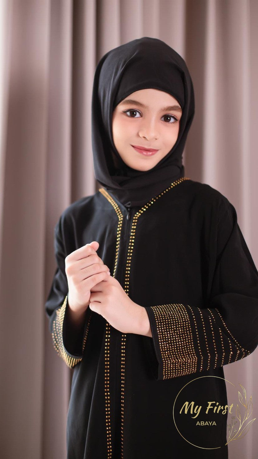 The Hawwa abaya. Modest black girls abaya with Swarovski rhinestones throughout the dress. Sizes available for young girls ages 4 to 12 years old.