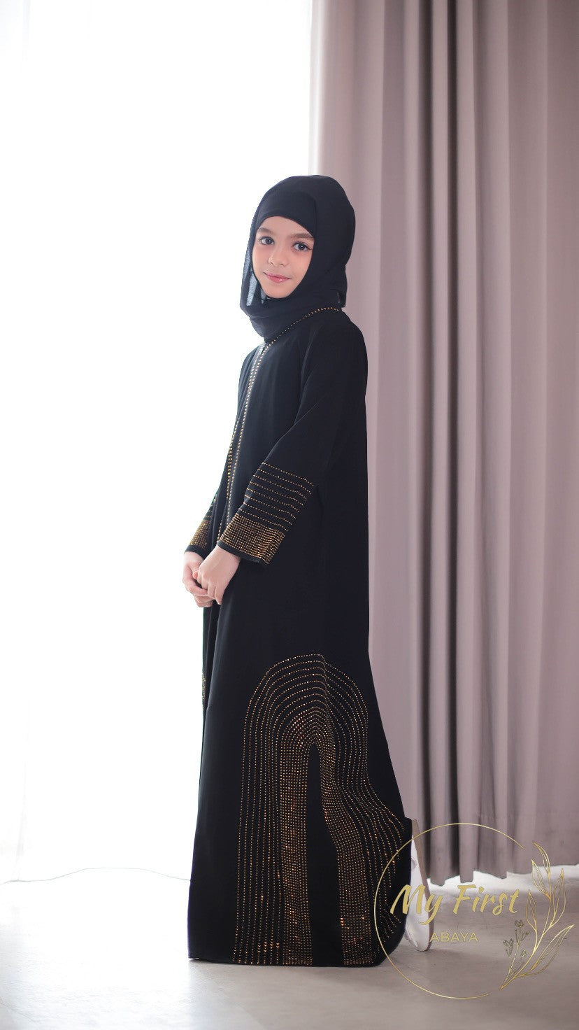 The Hawwa abaya. Modest black girls abaya with Swarovski rhinestones throughout the dress. Sizes available for young girls ages 4 to 12 years old.