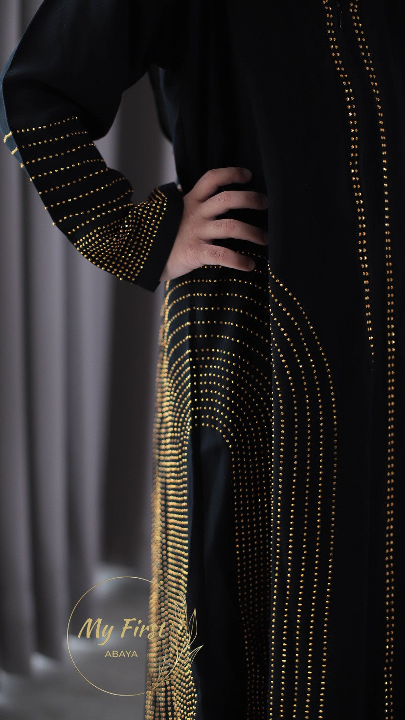 The Hawwa abaya. Modest black girls abaya with Swarovski rhinestones throughout the dress. Sizes available for young girls ages 4 to 12 years old.