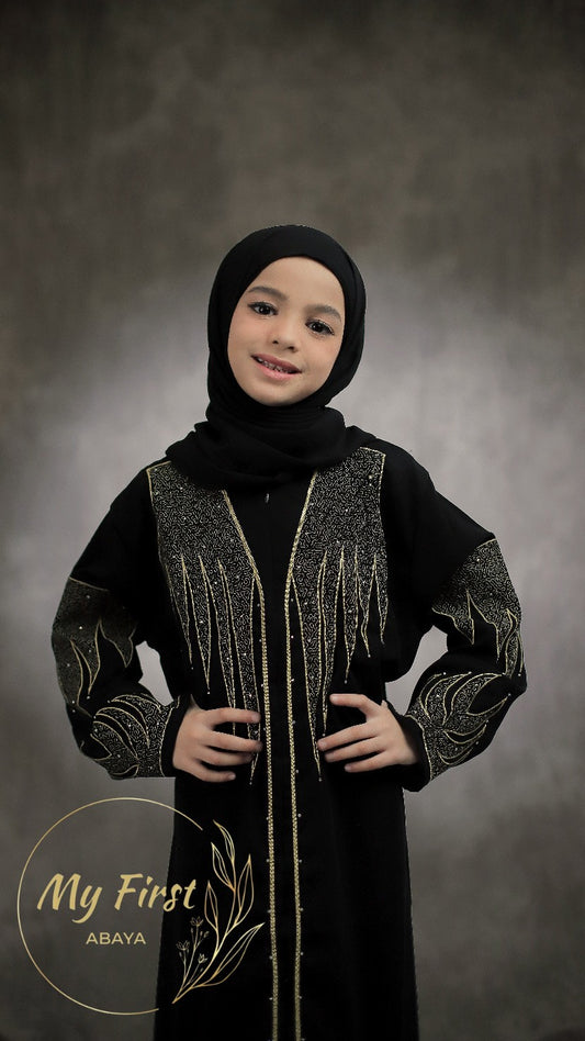 The Aisyah abaya. Modest dress for young girls ages 4 to 12 years of age. Plain black headscarf is included.