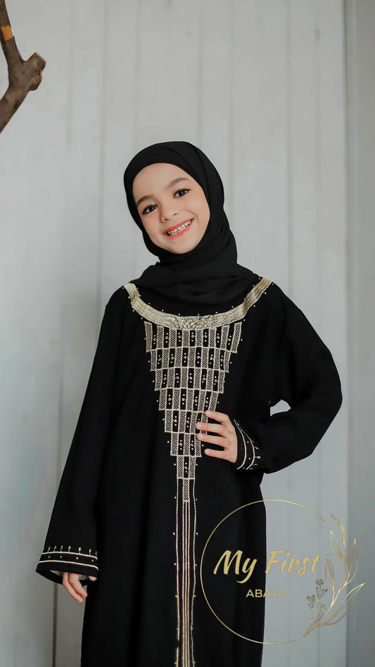 The Fatimah abaya. Modest dress for young girls ages 4 to 12 years of age. Plain black headscarf is included.