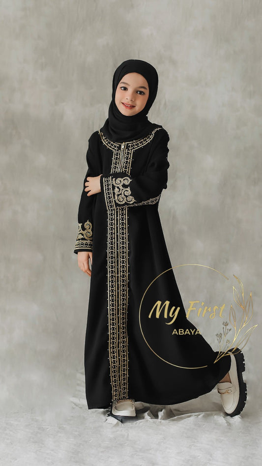 The Habiba abaya. Modest dress for young girls ages 4 to 12 years of age. Plain black headscarf is included.