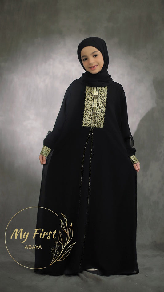 The Khadijah abaya. Modest dress for young girls ages 4 to 12 years of age. Plain black headscarf is included.