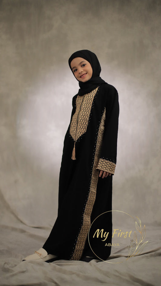 The Madinah abaya.  Modest dress for young girls ages 4 to 12 years of age. Plain black head scarf is included